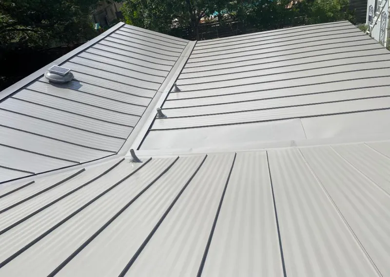 Solar attic fan installed on a metal roof for Roof Ventilation in Mount Laurel